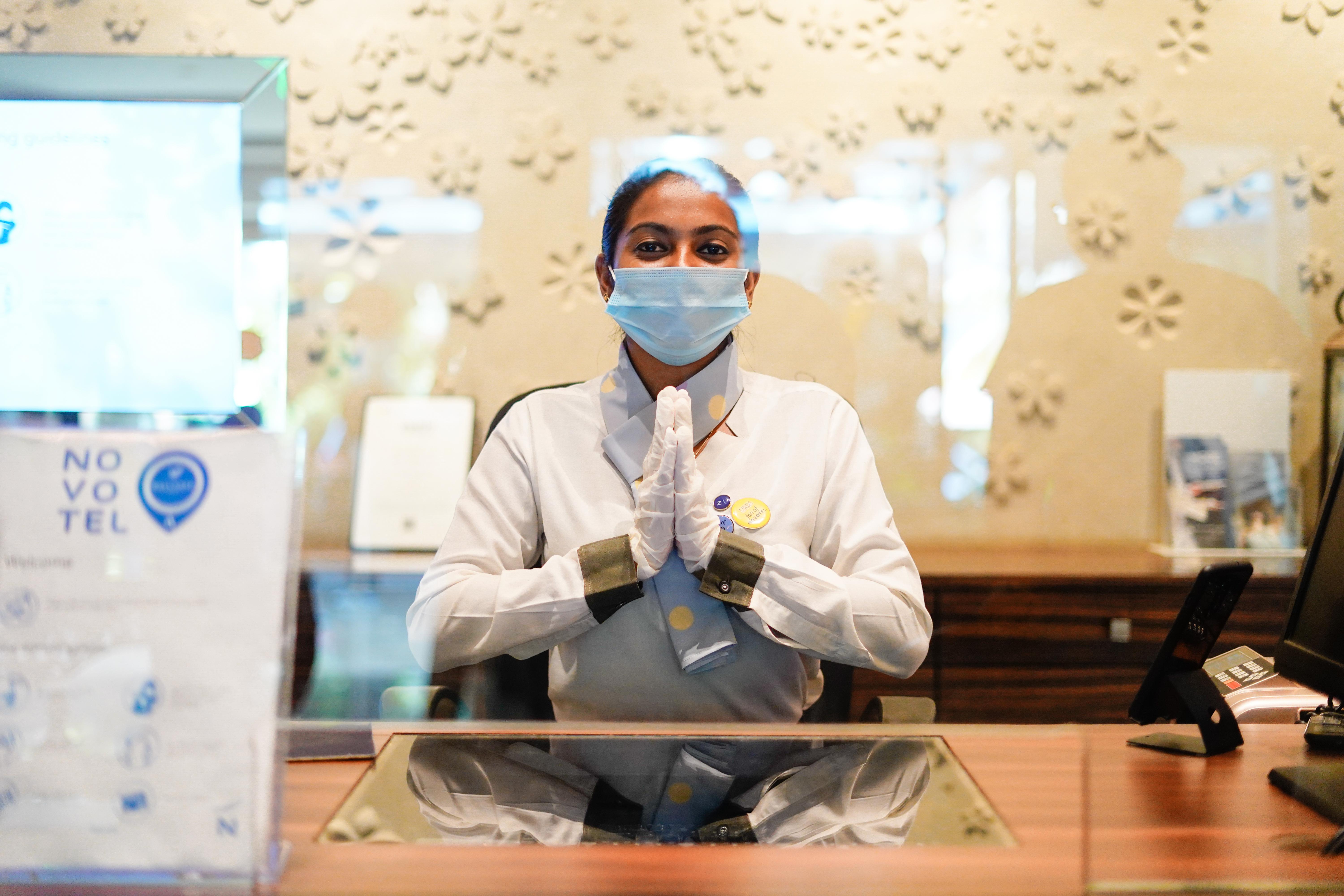 Novotel Goa Resort & Spa Candolim Eksteriør billede A hotel employee wearing a face mask